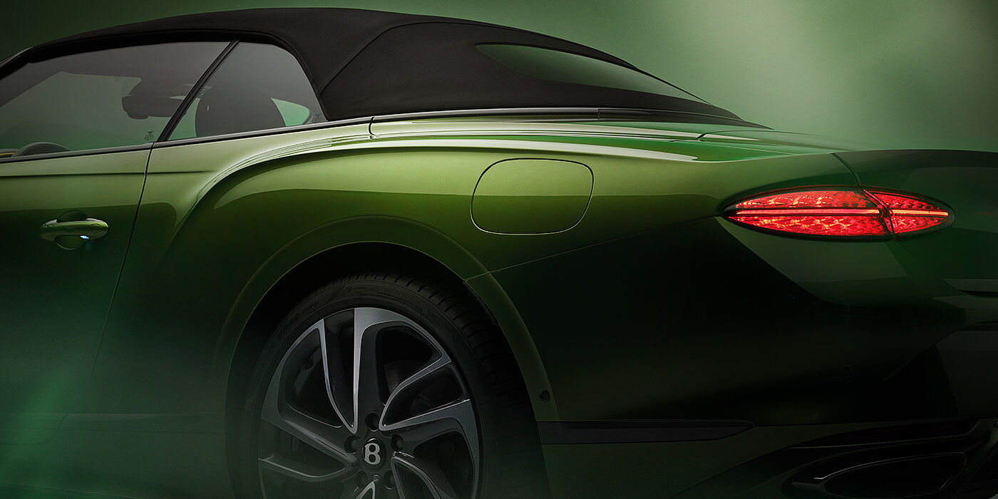 Bentley Hong Kong - DCH Bentley New Continental GTC Speed rear haunch and tail lamp in Tourmaline Green paint and dark tint brightware with black hood up and illuminated head lamps