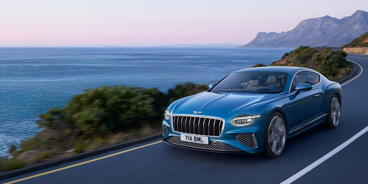 Bentley Hong Kong - DCH New Bentley Continental GT Azure coupe in Light Windsor blue paint with 22 inch Azure wheels and chrome grill, driving dynamically by the se