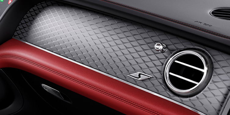 Bentley Hong Kong - DCH Bentley Bentayga S SUV front interior dash with Dark Tint Diamond Brushed Aluminium veneer and S badge surrounded by Hotspur red and Beluga black hide