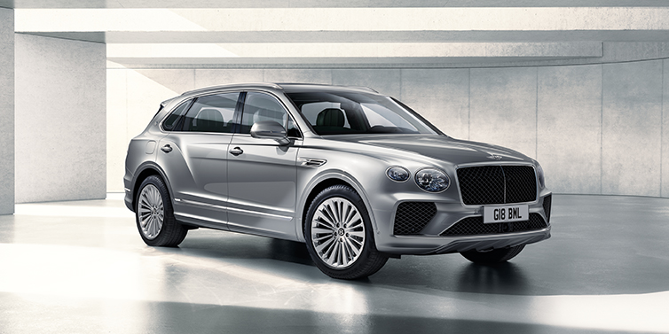 Bentley Hong Kong - DCH Bentley Bentayga Extended Wheelbase SUV front three quarter in Moonbeam paint with a grey background