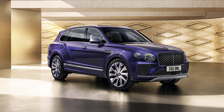 Bentley Hong Kong - DCH Bentley Bentayga Extended Wheelbase Mulliner SUV front three quarter in Tanzanite Purple paint with a gold patterned background
