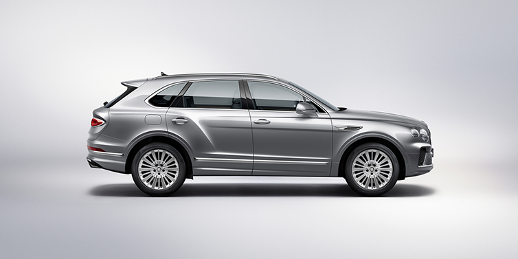 Bentley Hong Kong - DCH Bentley Bentayga SUV side profile in Moonbeam silver paint against white background featuring 21 inch 5 spoke wheels