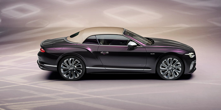 Bentley Hong Kong - DCH Bentley Continental GTC Mulliner convertible in profile with hood up, in Tanzanite Purple paint and 22 inch Mulliner painted and polished wheels