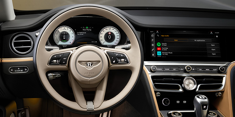 Bentley Hong Kong - DCH Bentley Flying Spur Mulliner sedan front interior detail of steering wheel and driver screens surrounded by Linen and Beluga black hides